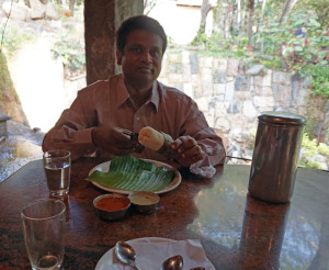 Antony with  Idly wrapped in banana leaves.